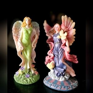 2 angelic figurines
